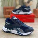 Zapatillas Reebok Caballero con Detalles en Cuero Vegano