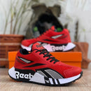 Zapatillas Reebok Caballero con Detalles en Cuero Vegano